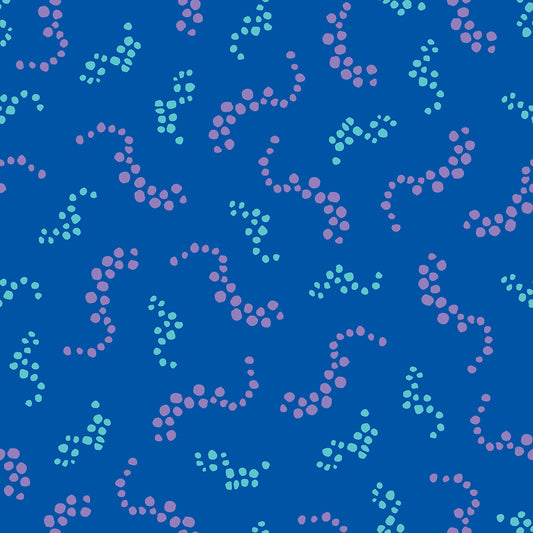 Beach Breezes Azure features a repeating pattern in azure, blue, aqua, and purple colors of swirling dots reminiscent of sea spray on ocean waves.