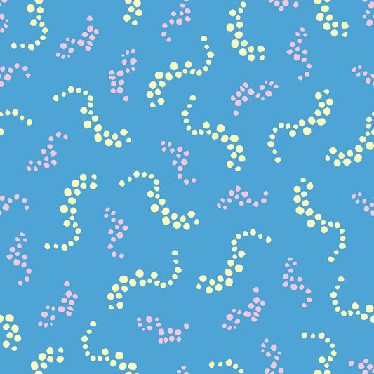 Beach Breezes Bloom features a repeating pattern in blue, pink, and yellow colors of swirling dots reminiscent of sea spray on ocean waves.