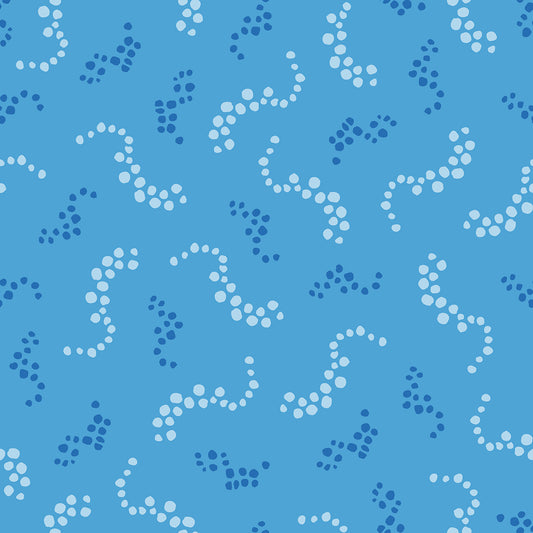 Beach Breezes Sky features a repeating pattern in blue colors of swirling dots reminiscent of sea spray on ocean waves.